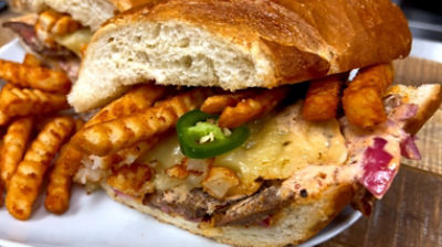 Steak sandwich loaded with fries 