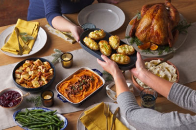 Two men handling a recyclable bag