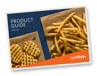 Fries on parchment paper with a blue background. 