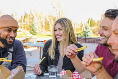 Group of People Eating Fries