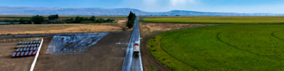Process_Truck driving next to farm